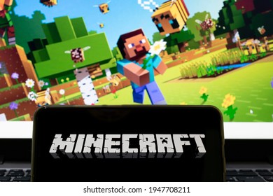 São Paulo, Brazil - April 1, 2021: cell phone with the name of the game Minecraft and the background screen blurred with the game application. Selective focus.
