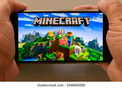 São Paulo, Brazil - April 2, 2021: Cell Phone In Hand With The Minecraft Game Application.