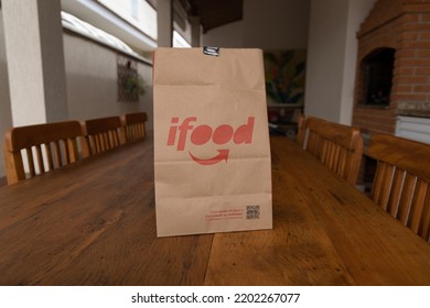 São Paulo, Brazil. August 20, 2022. Food Delivery Bag On Wooden Table.