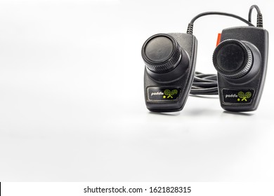 São Paulo, Brazil- January 19, 2020:  A Studio Shot Of A Atari 2600 Pong Paddle Controllers Isolated On A White Background.