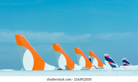 São Paulo, Brazil: May 24, 2022: Partial View Of Several Gol Airlines And Latam Airlines Planes Lined Up. Vertical Stabilizers And Rudder. Congonhas Airport.