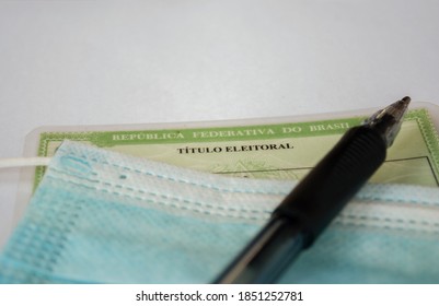 São Paulo, Brazil. November 9, 2020. Detail Of Eleitoral Title (voter Registration) Mask And Pen, Mandatory Items In Brazilian Elections.