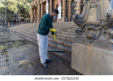 São Paulo, SP, Brazil, JUN 29, 2022, Public Employee Cleaning The Stairs Of The Municipal Theater In Downtown São Paulo