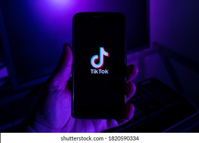 São Paulo, SP, Brazil September 20 2020: Man Holding Cell Phone With TikTok IPhone App X Close-up Of The Screen.