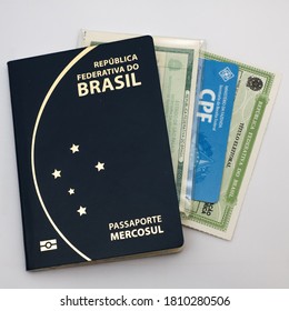 São Paulo, SP / Brazil - September 4th 2020: Brazilian Passport, ID Card, Individual Document And Voter Registration On White Background

