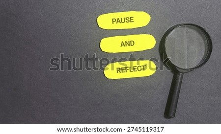 Pause and reflect message shown with a magnifying glass symbolizing deep consideration and careful examination of thoughts.