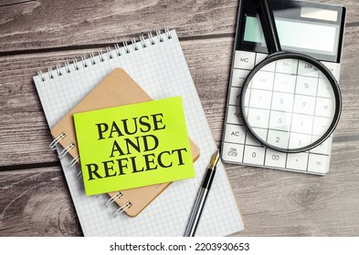 Pause And Reflect The Phrase On Green Paper And Office Supplies