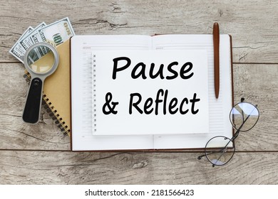 Pause And Reflect The Phrase Written On An Open Notepad