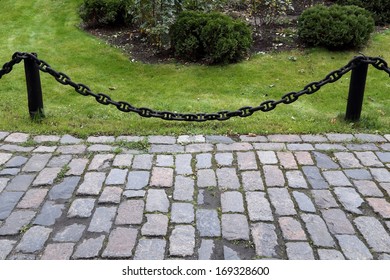 Paved path with a chain guard.