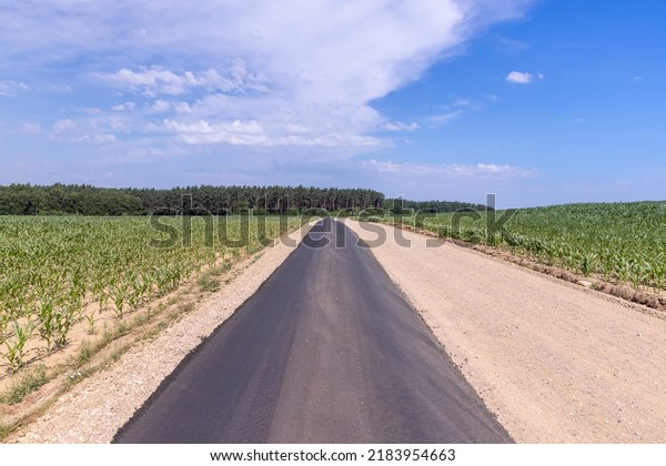 paved road for car traffic,\
construction of a new paved road for transport in rural\
areas