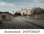 Paved stone road to the Lublin Castle. Facade and tower of the castle