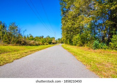 A Paved Walking Path At The Augusta Canal In The Fall