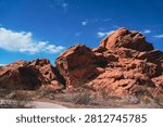 Paved walking path by red rock formations at Lake Mead National Recreation Area, Nevada, USA