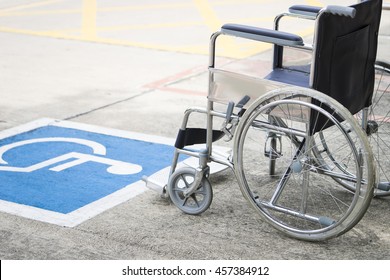 Pavement handicap symbol and wheelchair