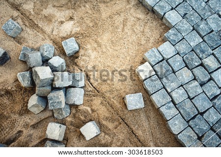 Pavement rocks, stones and cobblestone blocks, construction of path, road or sidewalk
