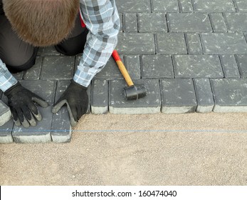 Paver Laying Driveway Pavement Out Of Concrete Pavement Blocks