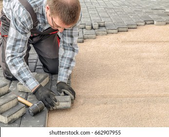 Paver Laying Driveway Pavement Out Of Concrete Pavement Blocks