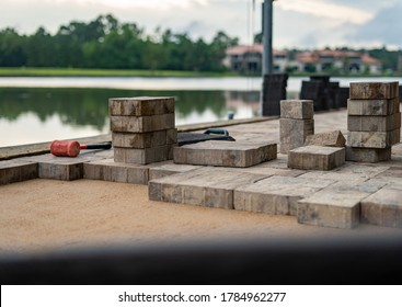 Pavers Being Installed By Hand 