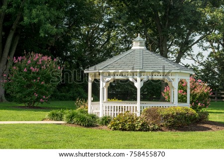 A pavilion or gazebo in a beautiful public garden park. Сток-фото © 