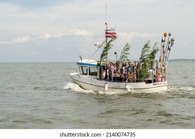 Pavilosta, Latvia - July 9, 2016: People Ride A Small Ship On Baltic Sea On A Sunny Summer Day.