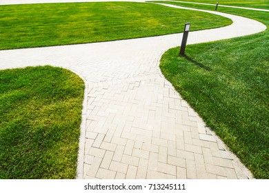 paving slab and lawn - Shutterstock ID 713245111