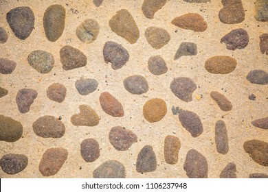 ?obblestone as paving stone, Conglomerate of assorted irregular pebbles in cement