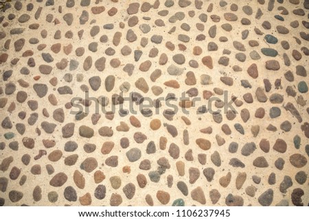 ?obblestone as paving stone, Conglomerate of assorted irregular pebbles in cement