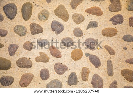?obblestone as paving stone, Conglomerate of assorted irregular pebbles in cement