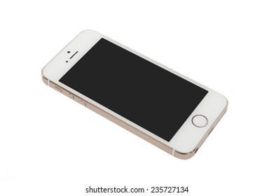 Pavlograd, Ukraine - December 4, 2014: Apple Gold iPhone 5S isolated on white background