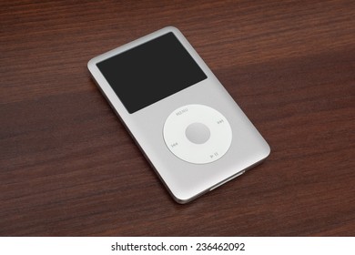 Pavlograd, Ukraine - December 4, 2014: iPod classic 160 Gb. Studio shot on wooden background.