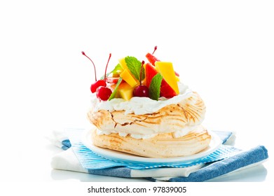 Pavlova With Fresh Fruit (mango, Pineapple, Watermelon, Cherry) Ready  To Serve, On White Background As A Studio Shot