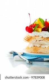 Pavlova With Fresh Fruit (mango, Pineapple, Watermelon, Cherry) Ready  To Serve, On White Background As A Studio Shot