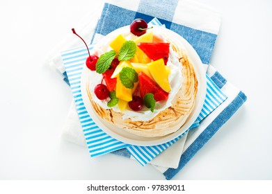 Pavlova With Fresh Fruit (mango, Pineapple, Watermelon, Cherry) Ready  To Serve, On White Background As A Studio Shot