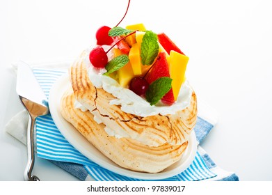 Pavlova With Fresh Fruit (mango, Pineapple, Watermelon, Cherry) Ready  To Serve, On White Background As A Studio Shot