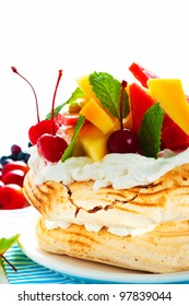 Pavlova With Fresh Fruit (mango, Pineapple, Watermelon, Cherry) Ready  To Serve, On White Background As A Studio Shot