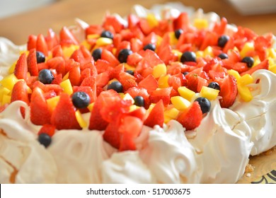 Pavlova Meringue Cake Decorated With  Strawberry , Pineapple And Blueberries