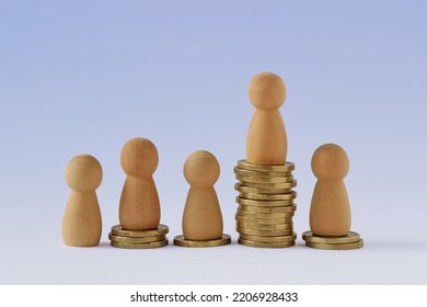 Pawns On Stacks Of Coins - Concept Of Economic Inequality