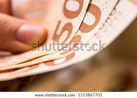 pay with 50 euro	money banknotes