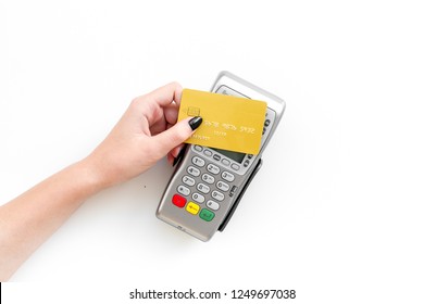 Pay By Payment Terminal. Paypass  Technology. Woman's Hand Hold Credit Card, Bring Card To Terminal  On White Background Top View Copy Space