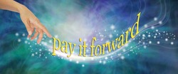 Pay It Forward With Loving Sparkles - Female Hand Appearing To Send Out A Whoosh Of Sparkles With The Words PAY IT FORWARDS Against A Blue Green Wispy Background
