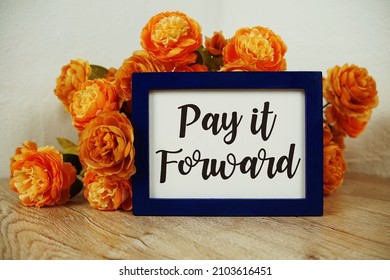 Pay It Forward Text And Flower Bouquet On Wooden Table Interior Decoration