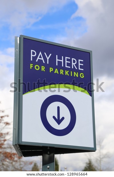 Pay here car parking\
sign