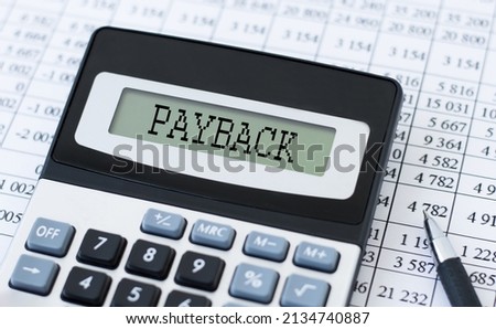 PAYBACK word on Calculator and pen on bank account documents