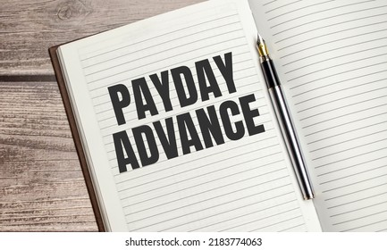 Payday Advance Text On A Notepad With Pen, Business