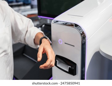 Paying with personal information devices. Female person paying using her smart watches. Contactless payment. - Powered by Shutterstock