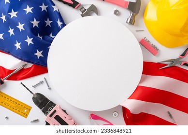 Paying tribute to female workers on Labor Day. Top view image of an American flag accompanied by pink building equipment on white isolated background. Perfect for advertisements or text placement - Powered by Shutterstock