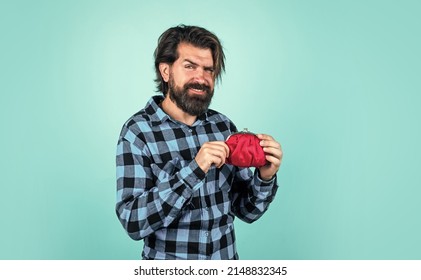 payment concept. brutal handsome man with moustache. mature customer with wallet. masculinity and charisma. concept of money saving. casual bearded hipster hold purse