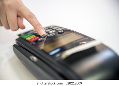 Payment With Credit Card - Businessman Holding Pos Terminal. Hand Pin Code On Pin Pad Of Card Machine Or Pos Terminal 