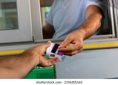 Payment of the fare on the way. Concept of new technologies in road transport and toll roads. - Shutterstock ID 2196305163