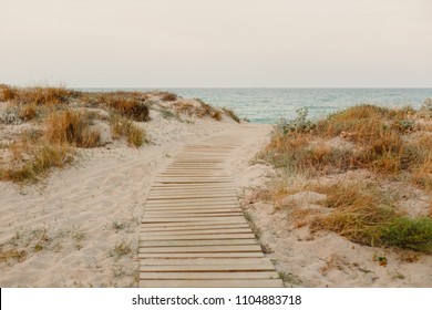 Payment Management Wooden path over the sand of the beach dunes - Powered by Shutterstock